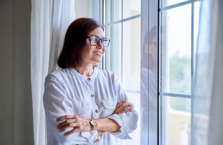 business-middle-aged-woman-looking-out-the-window-2022-03-29-23-48-54-utc